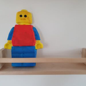 Lego pop van gips op plankje
